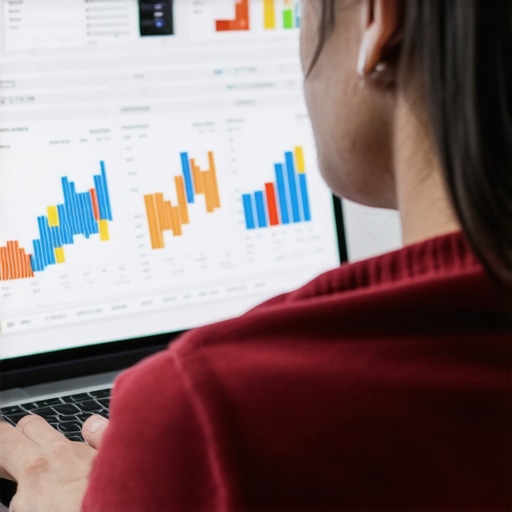 Person reviewing maps SEO data with graphs and charts on a laptop